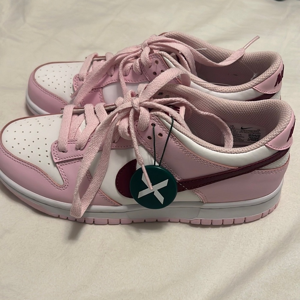 Brand new Pink Foam Nike Dunks with Stock X verification tag
